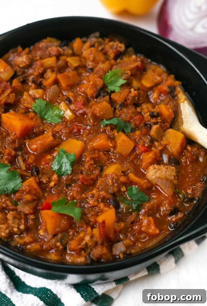 A pot of Butternut Squash Turkey Chili with cilantro