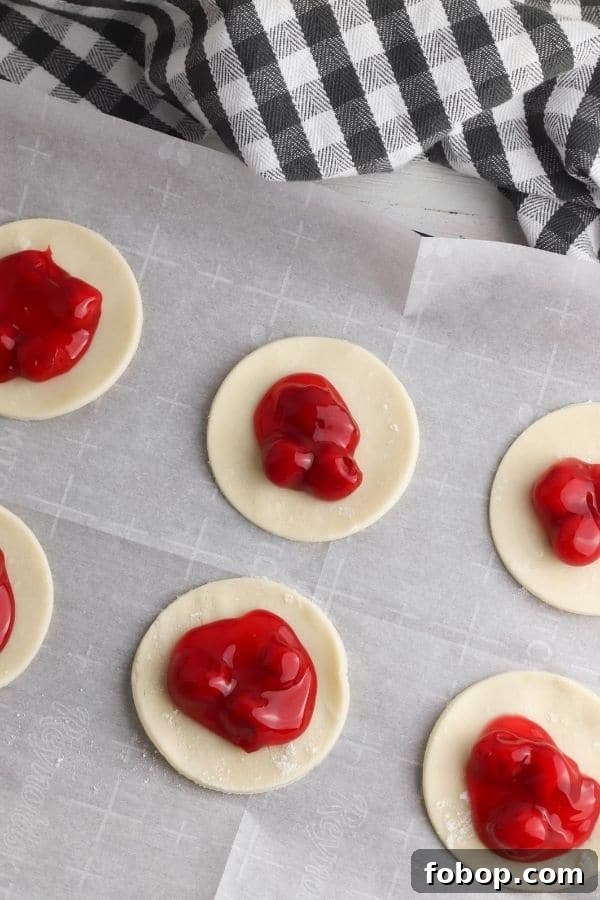 pie crust with cherry pie filling in center 