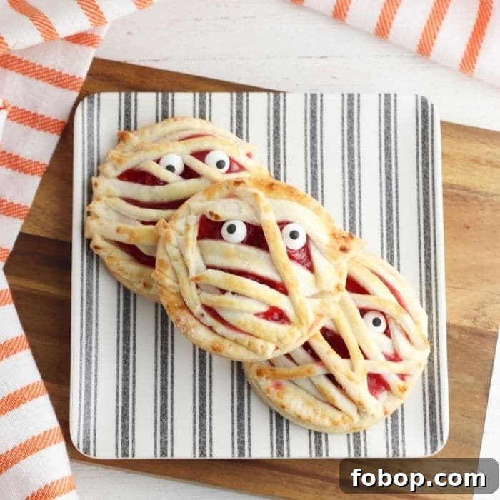 stack of Halloween pies on cutting board