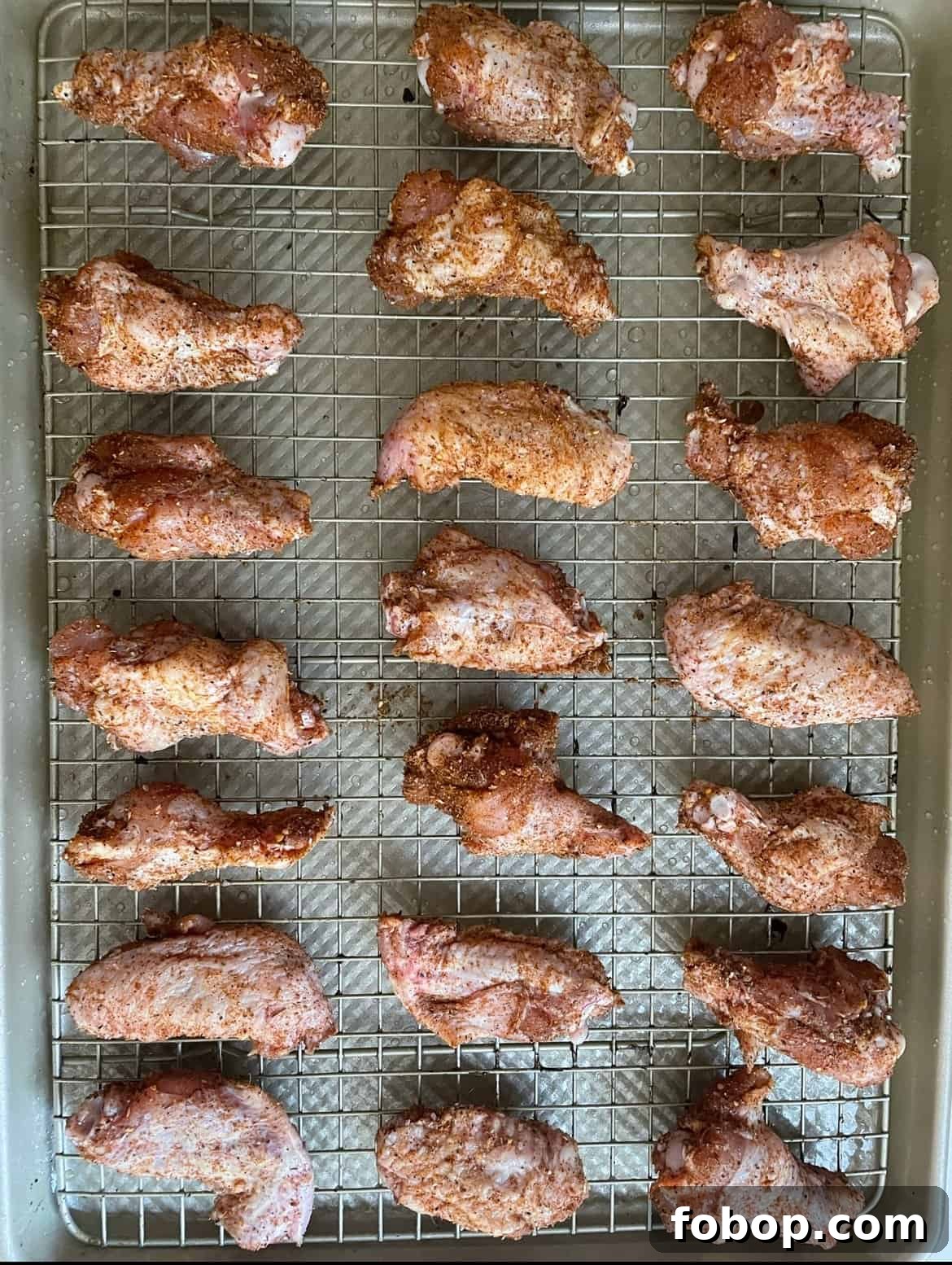 Crispy Cajun BBQ Oven Wings: Super Crunchy Baked Recipe 5 chicken wings on a cooling rack
