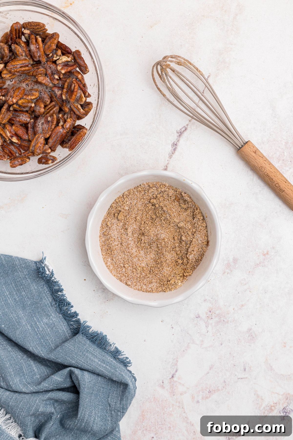 Sugars and other ingredients mixed in a small white bowl. 