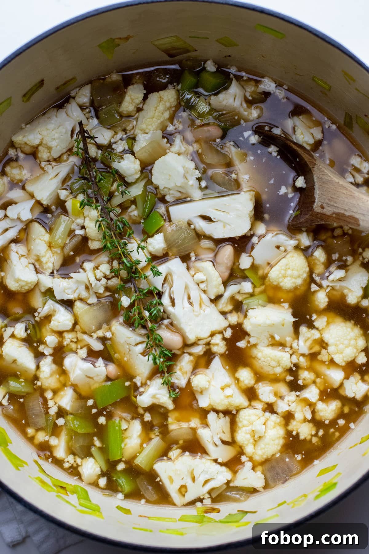 Creamy Vegan Cauliflower Soup Recipe — Dairy-Free Comfort Bowl 5 Ingredients for cream of cauliflower soup in a white pot.