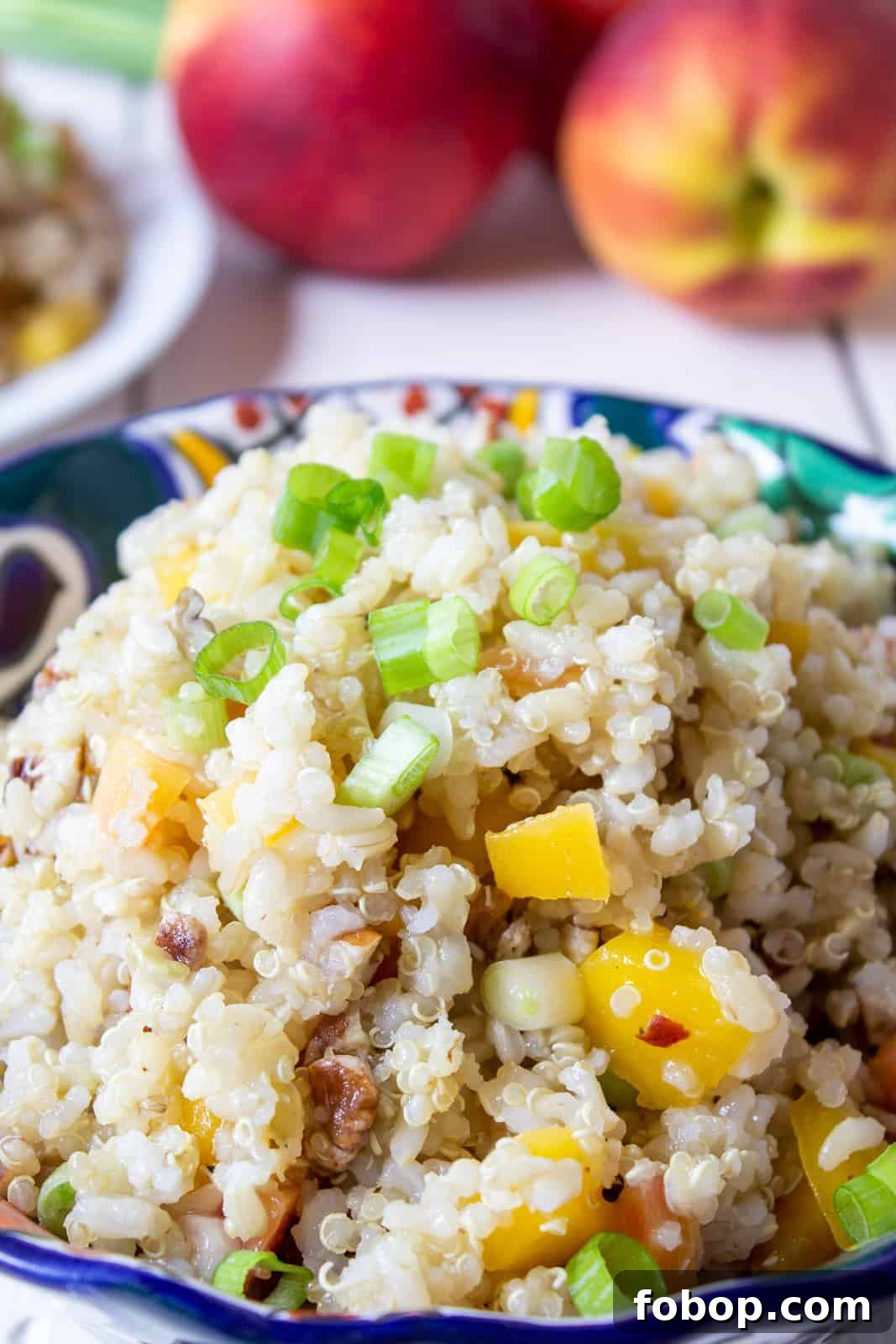 Quinoa and rice salad in a colorful bowl. 