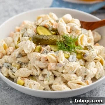 A bowl filled with Dill Pickle Pasta Salad.
