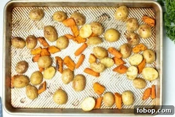 Crispy Roasted Carrots and Potatoes with Garlic and Herbs 5 Roasted potatoes and carrots on sheet pan.