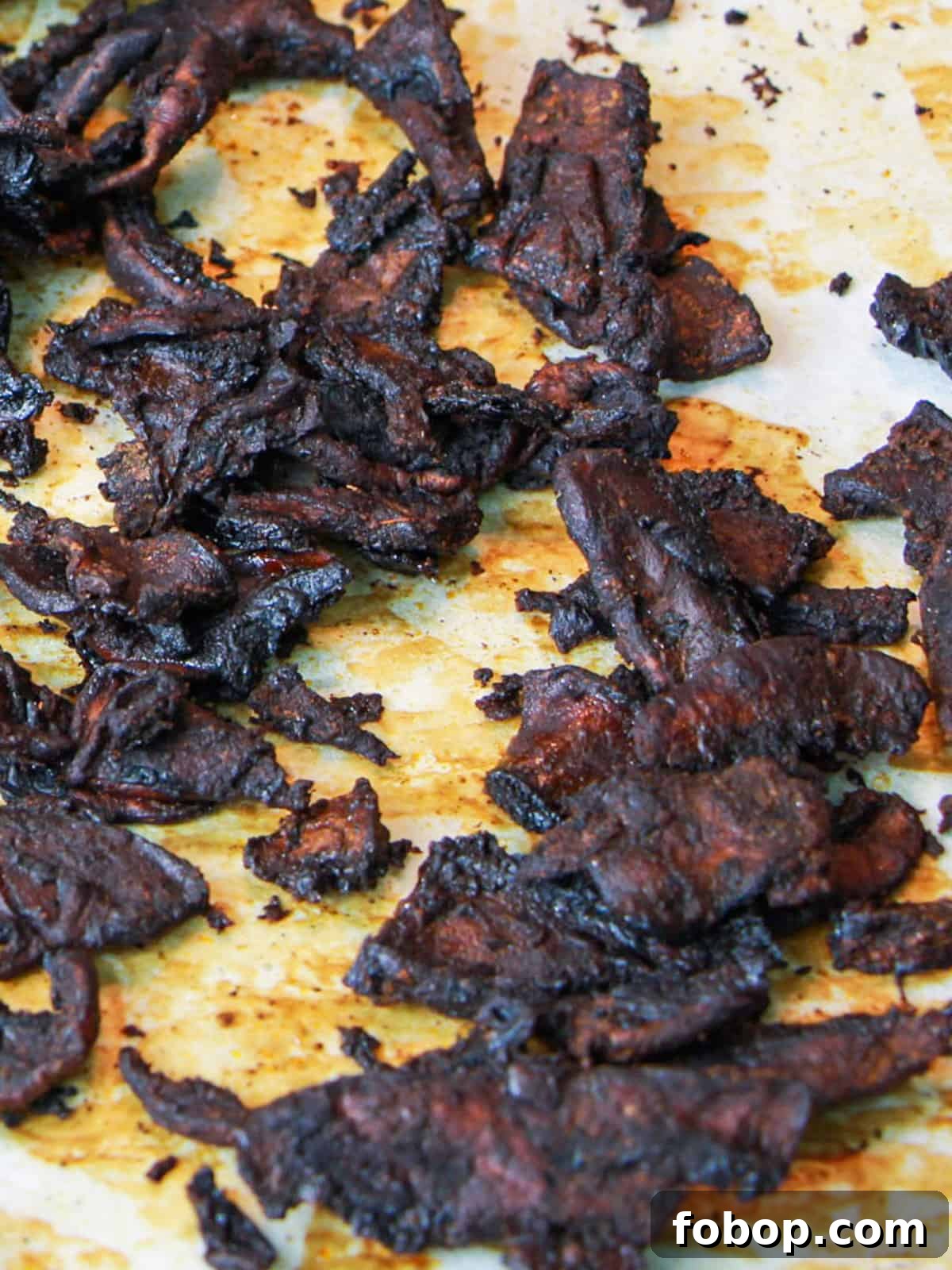 Spinach & Butternut Squash Salad with Smoky Mushroom Bacon and Vegan Feta 5 Photo of mushroom bacon on a roasting tin after it has been roasted.