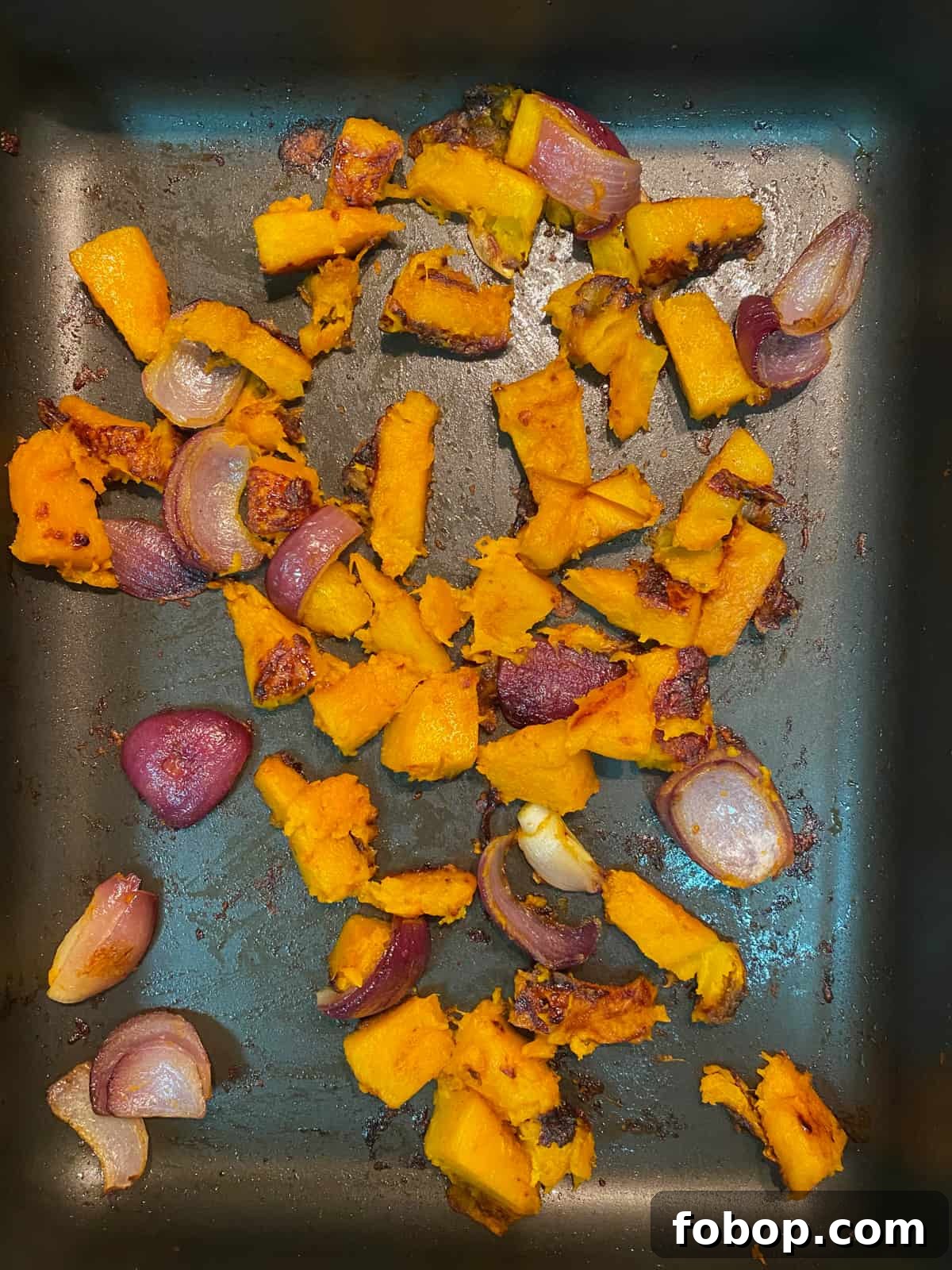 Spinach & Butternut Squash Salad with Smoky Mushroom Bacon and Vegan Feta 7 roasting tin with butternut squash and red onion having roasted for half an hour.