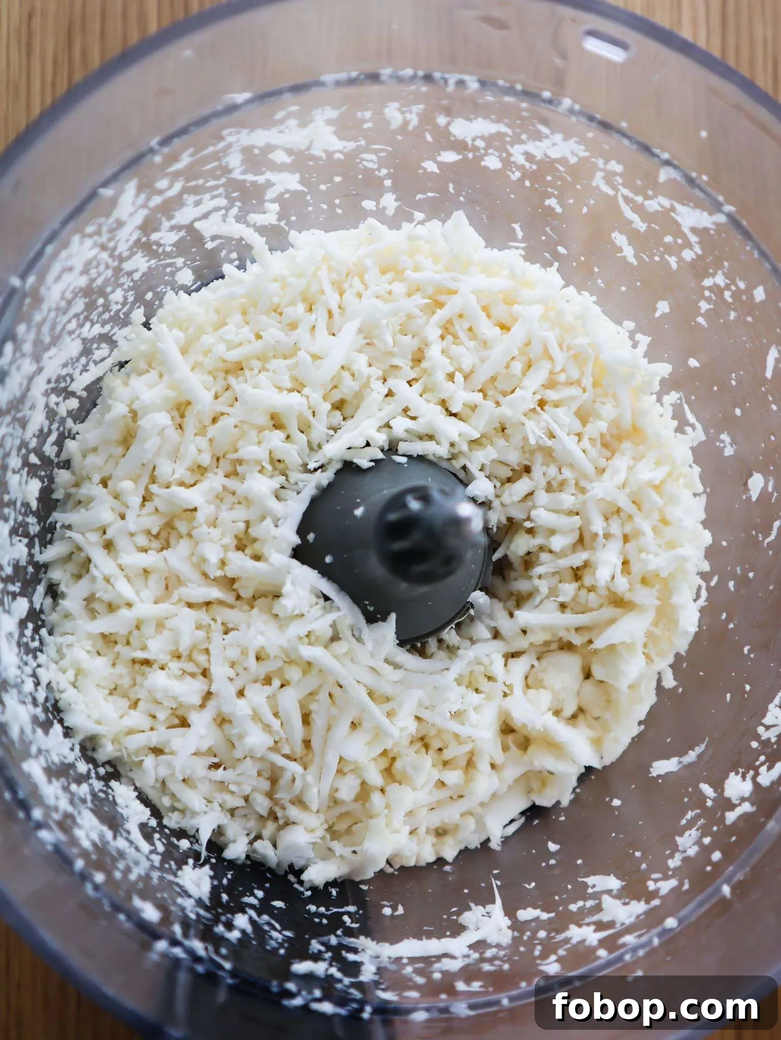 How to Make Cauliflower Rice: Simple Homemade Recipe 5 using the grater attachment on your food processor