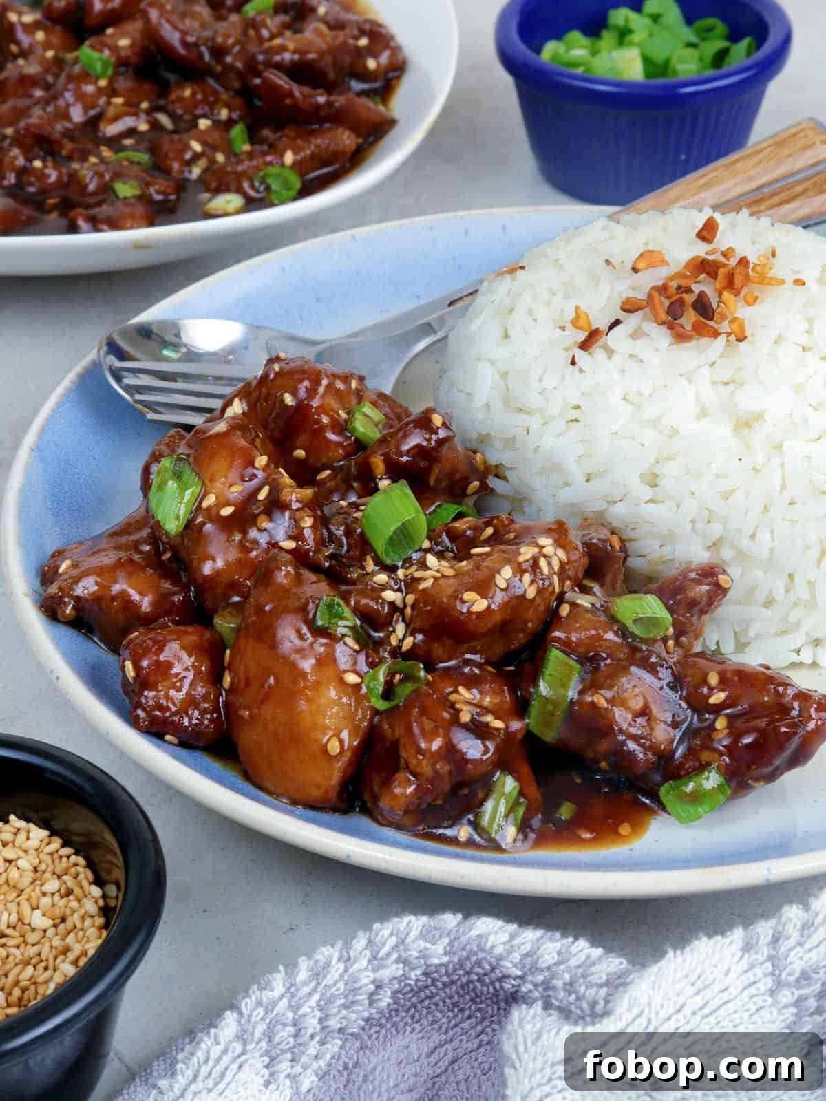 Calamansi Chicken Recipe: Tangy Citrus-Glazed Roast Chicken 5 Calamansi Chicken on a white serving platter with steamed rice