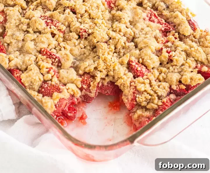 crumble in a baking pan with a scoop taken out of it