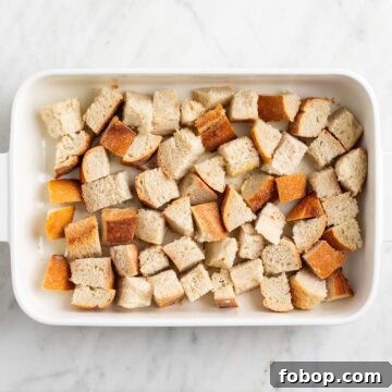 Crusty bread pieces in a baking dish.
