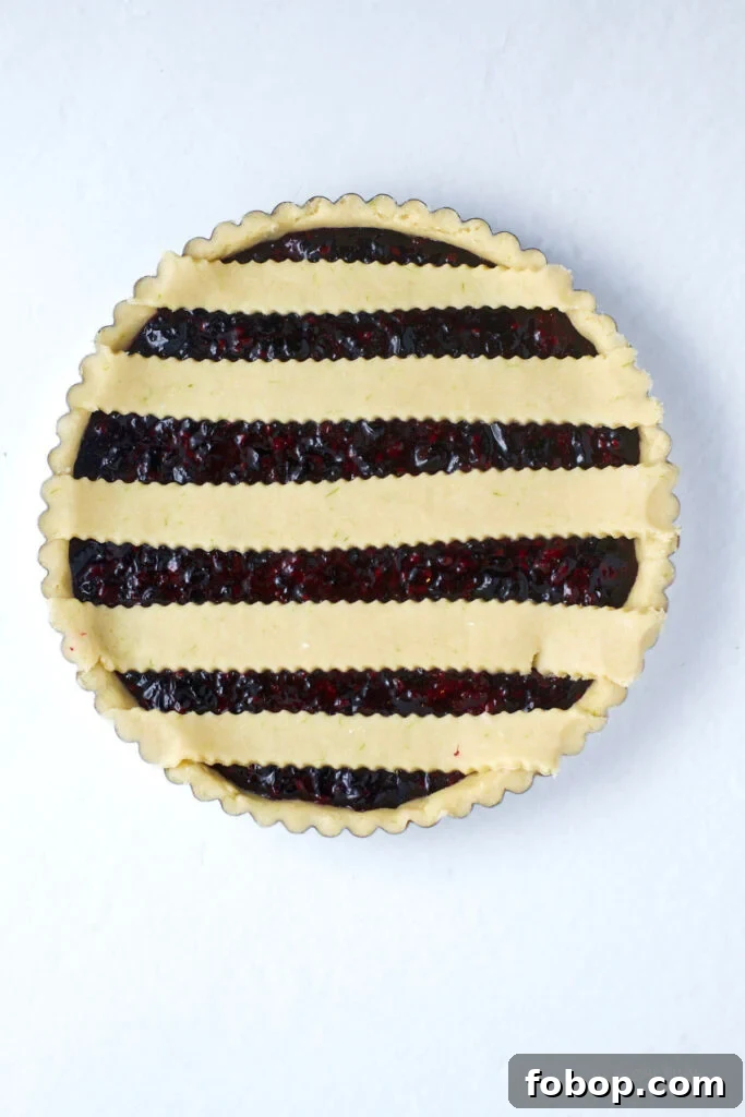 Blackberry Crostata Recipe: Rustic Tart with Fresh Berries 11 first layer of lattice top over blackberry filling