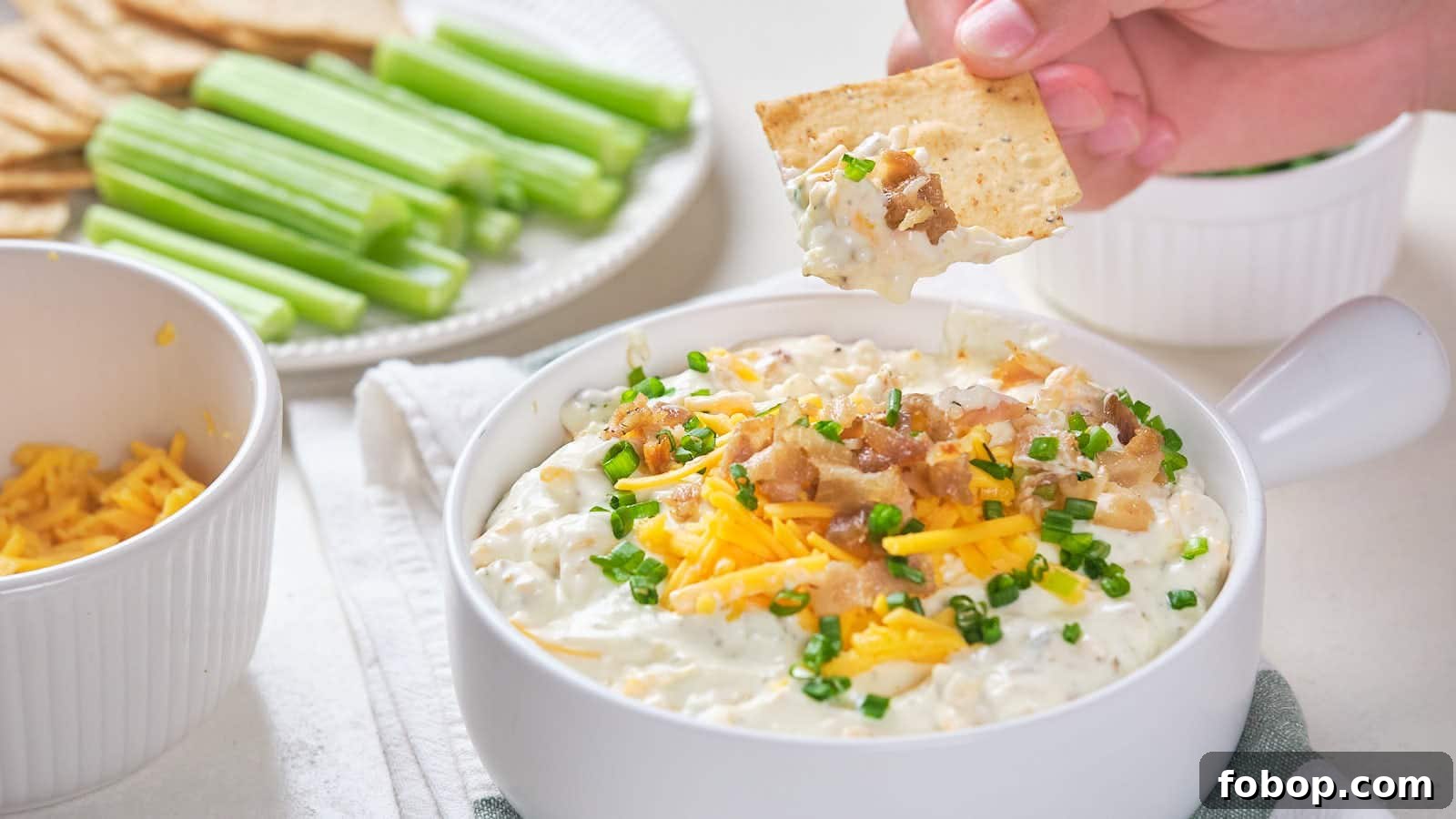 13 Delicious Low-Carb Snacks That Beat Potato Chips 2 Bacon cheddar dip with shredded cheddar cheese, bacon bits, and chive garnish.