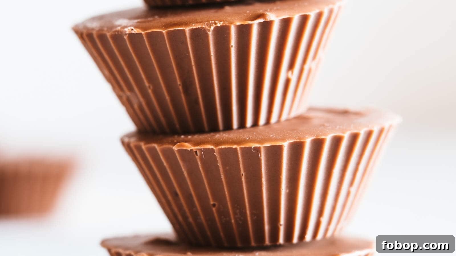 13 Delicious Low-Carb Snacks That Beat Potato Chips 3 Close up of a stack of peanut butter cups with blurred background.