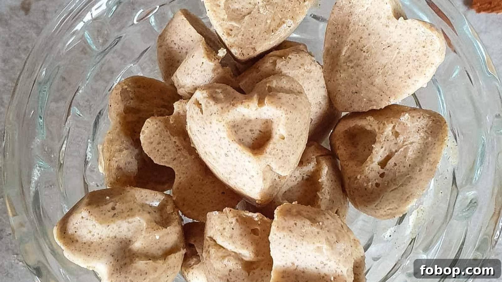 13 Delicious Low-Carb Snacks That Beat Potato Chips 4 Cinnamon butter bombs candies in a glass dish on stone countertop.