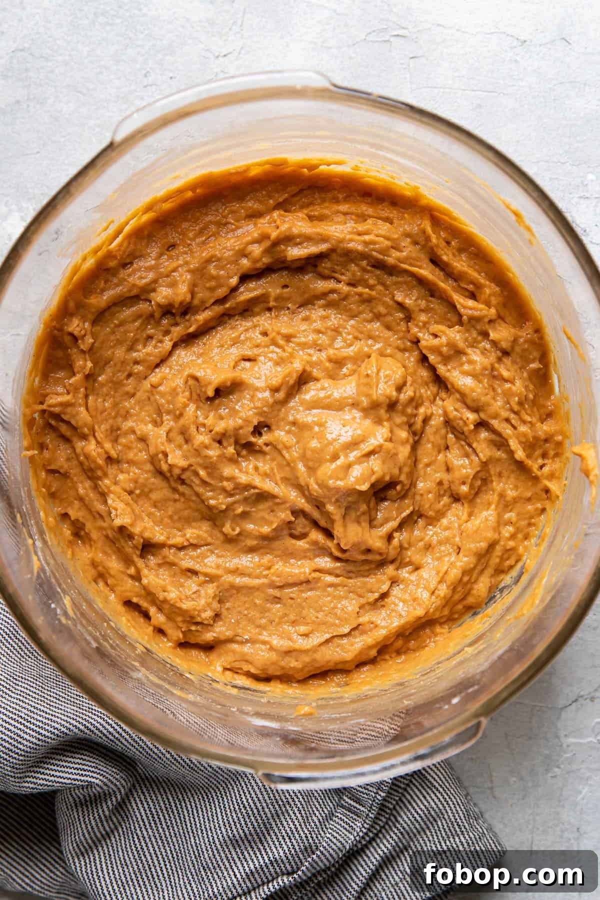 Moist Pumpkin Muffins with Warm Spices — Simple Fall Recipe 5 pumpkin muffin batter in a bowl.