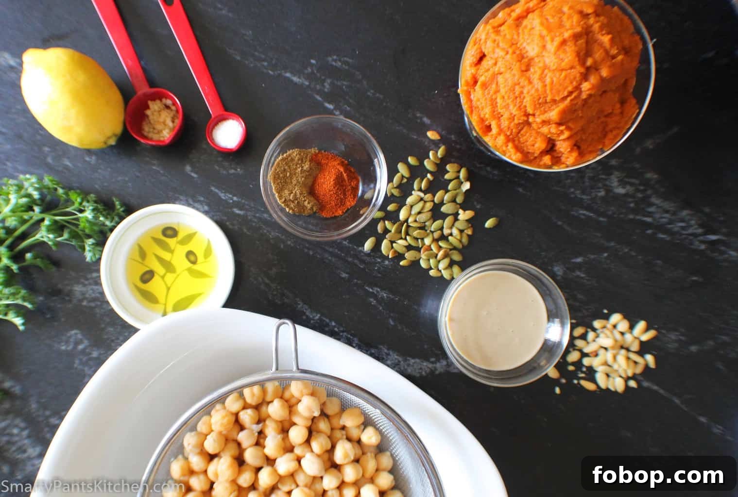 Creamy Pumpkin Hummus Recipe for Fall Entertaining 3 Ingredients for hummus on black marble counter