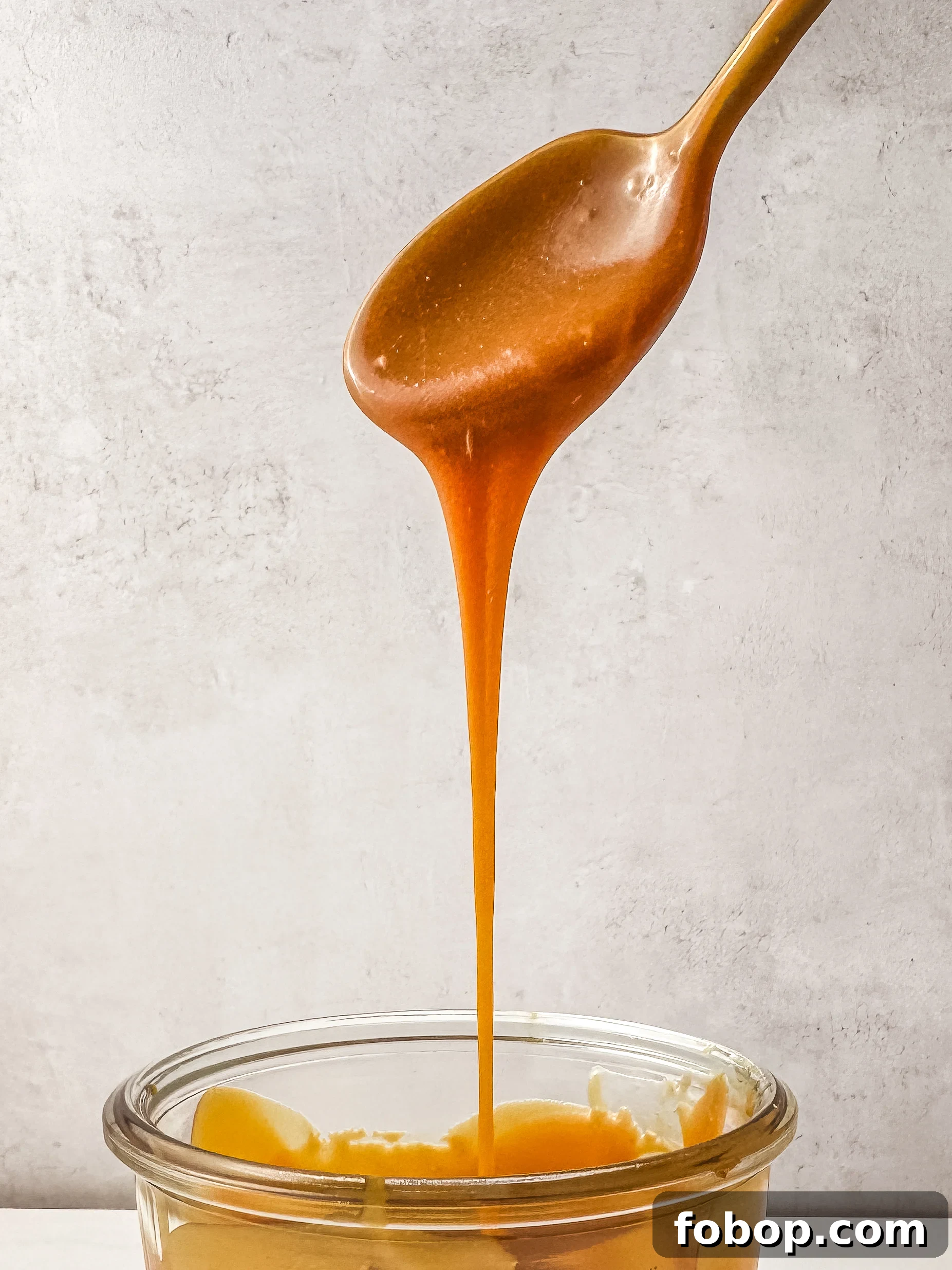 Homemade Caramel Recipe: Smooth, Rich Caramel Sauce in Minutes 3 Caramel drizzling over dessert