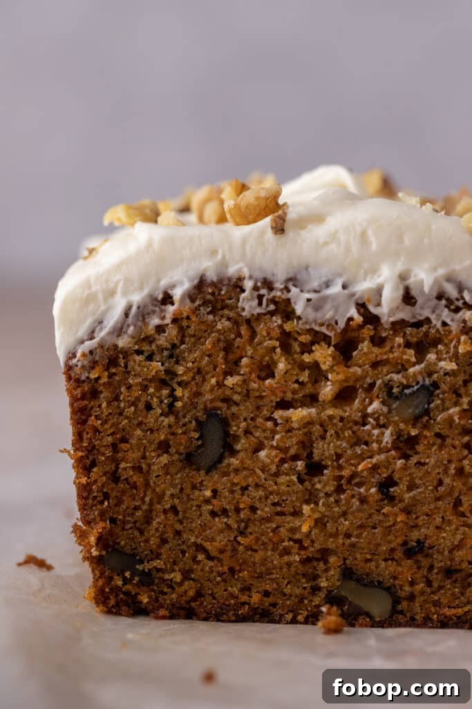 Moist Carrot Loaf Cake Recipe with Oil (Loaf Pan Method) 5 Close-up of moist carrot loaf crumb with cream cheese frosting