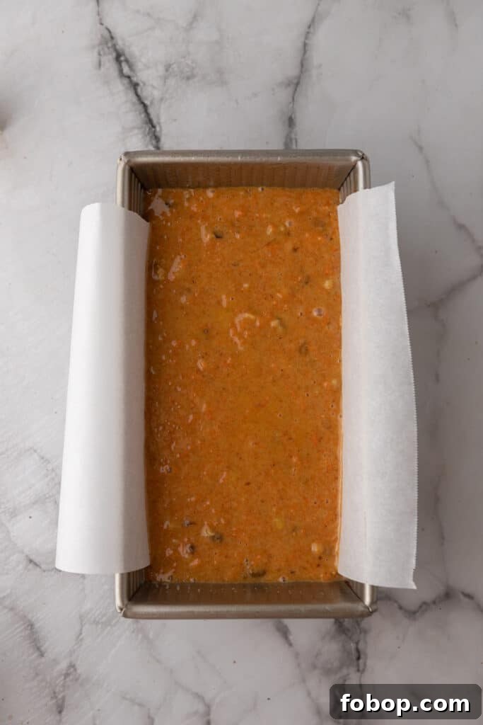 Moist Carrot Loaf Cake Recipe with Oil (Loaf Pan Method) 9 Carrot cake batter in a lined 9x5 loaf pan before baking