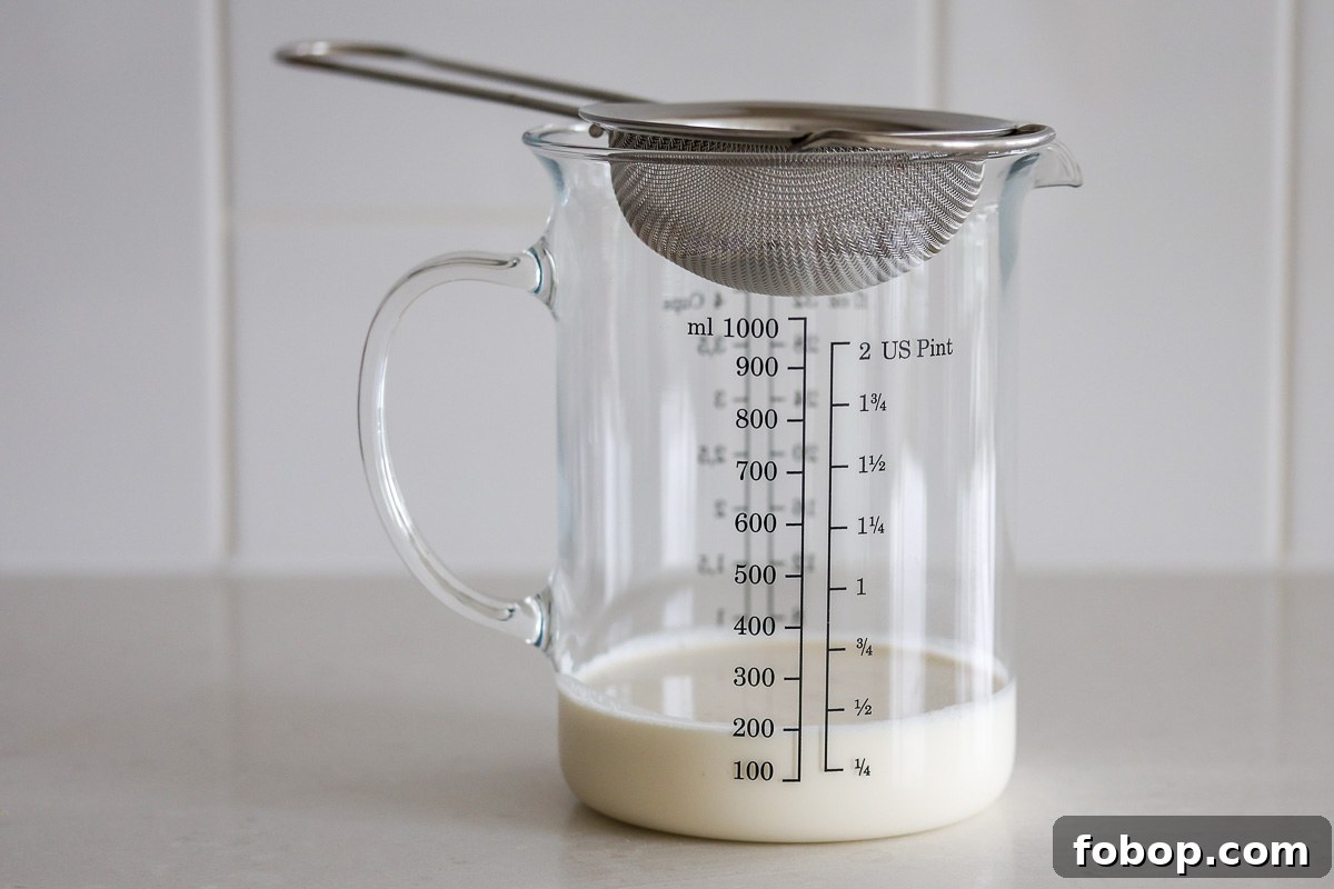 Lavender Whipped Cream Recipe: Light Floral Dessert Topping 5 A metal mesh strain, a glass container and heavy cream.