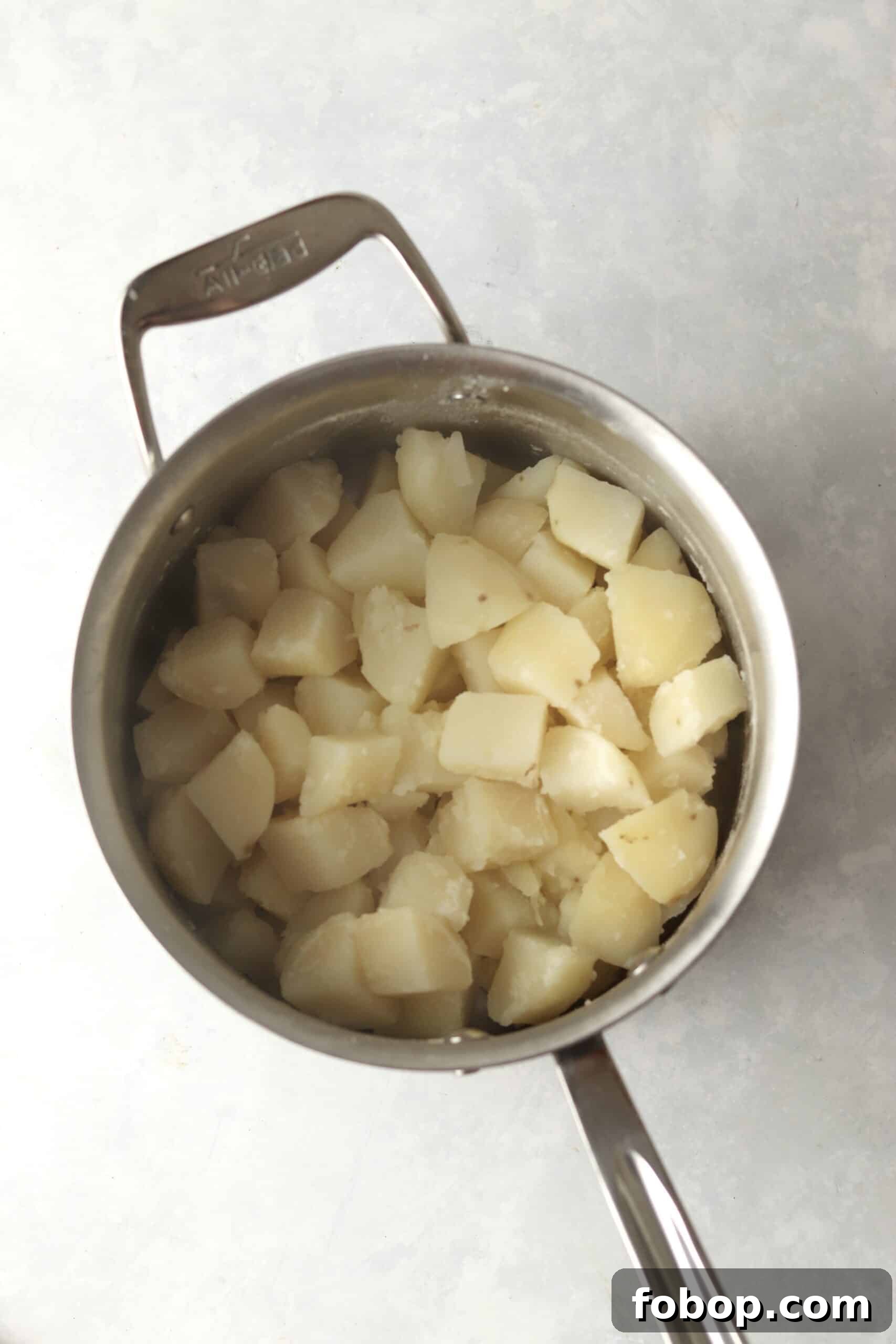 cooked russet potatoes in pot