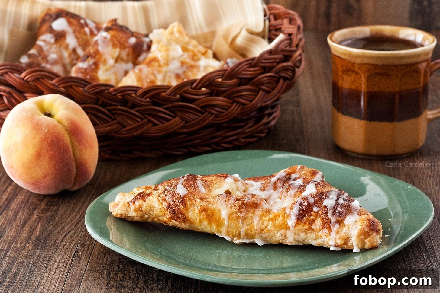 Peach Turnovers with Flaky Puff Pastry Recipe 3 Whole Peach Turnover on green plate