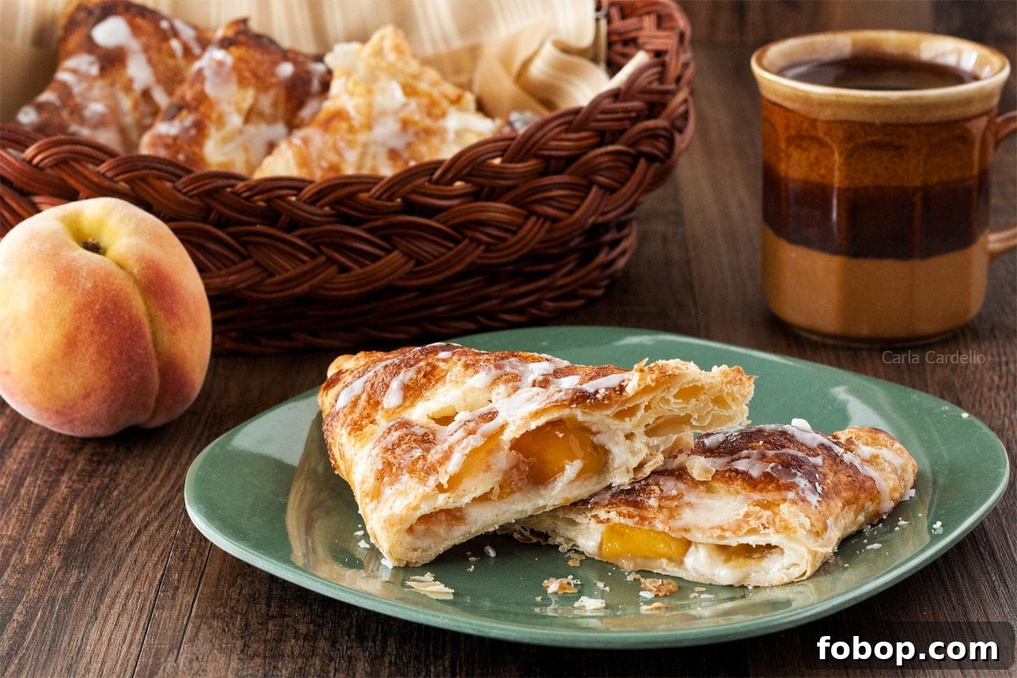 Peach Turnovers with Flaky Puff Pastry Recipe 6 Peach Turnovers cut in half on plate