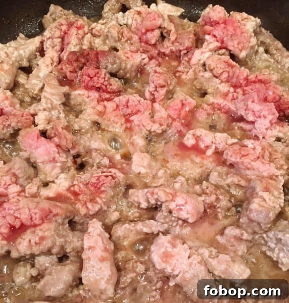 Cube Steak cooking in skillet