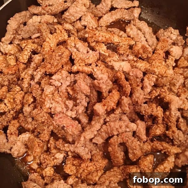 Steak cooking in skillet