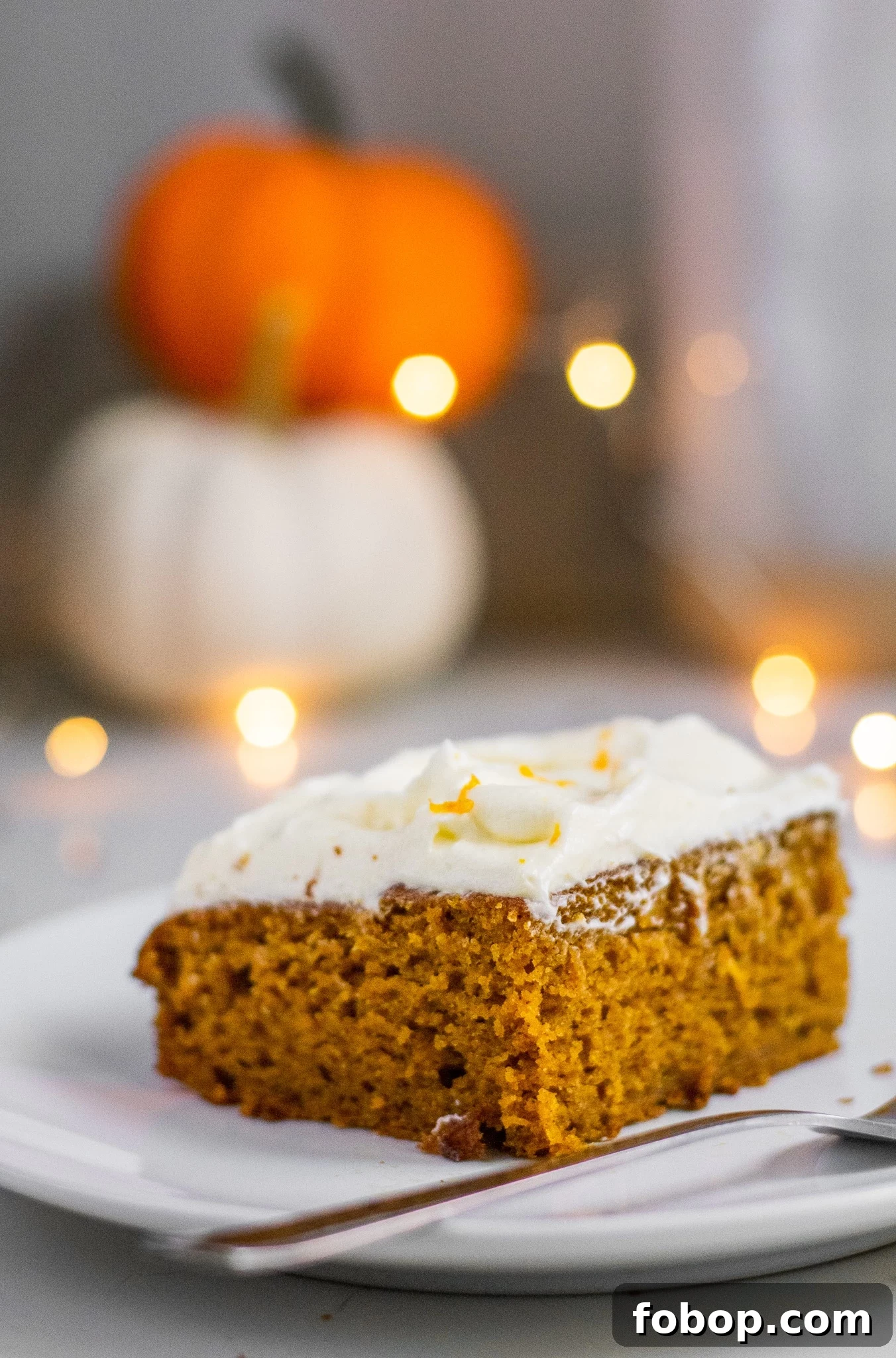 Pumpkin Cake Recipe: Moist Danish Græskarkage (Step-by-Step) 11 A slice of pumpkin cake with cream cheese frosting.