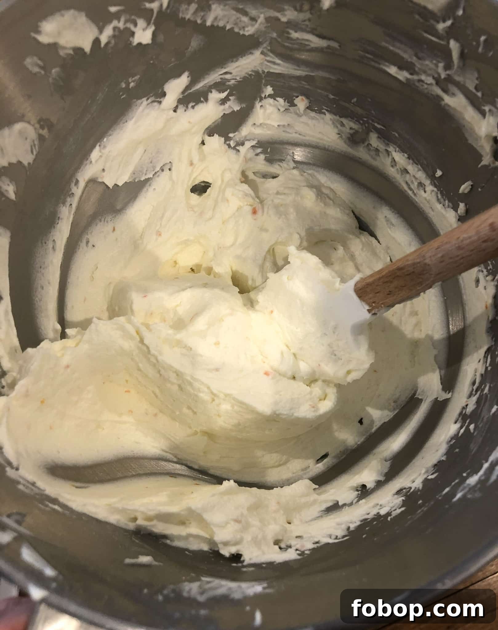 Pumpkin Cake Recipe: Moist Danish Græskarkage (Step-by-Step) 19 Mixing frosting in a bowl.