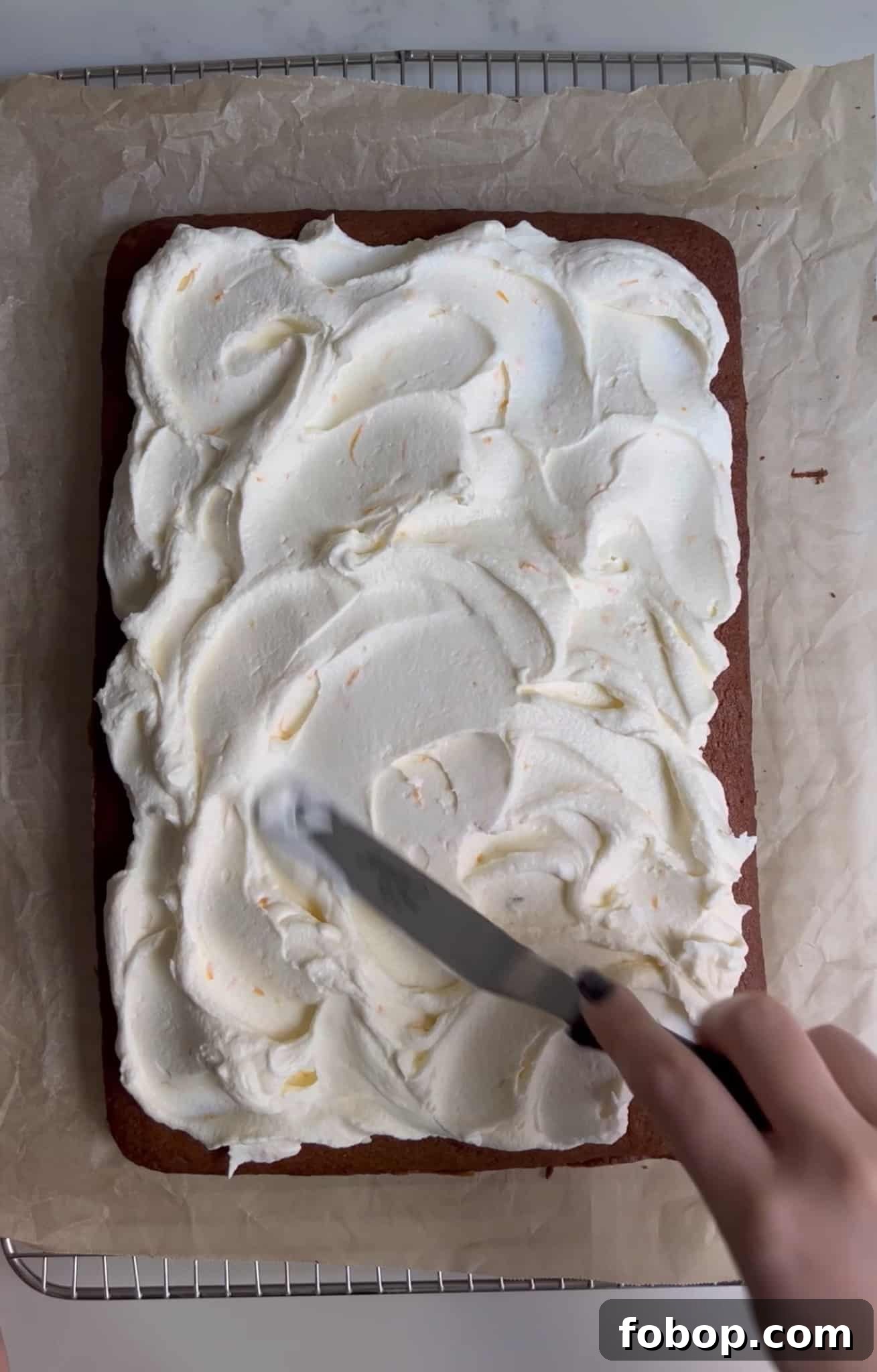 Pumpkin Cake Recipe: Moist Danish Græskarkage (Step-by-Step) 20 Adding cream cheese frosting to the top.