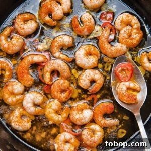 Close up shot of prawns with chilli oil in a pan