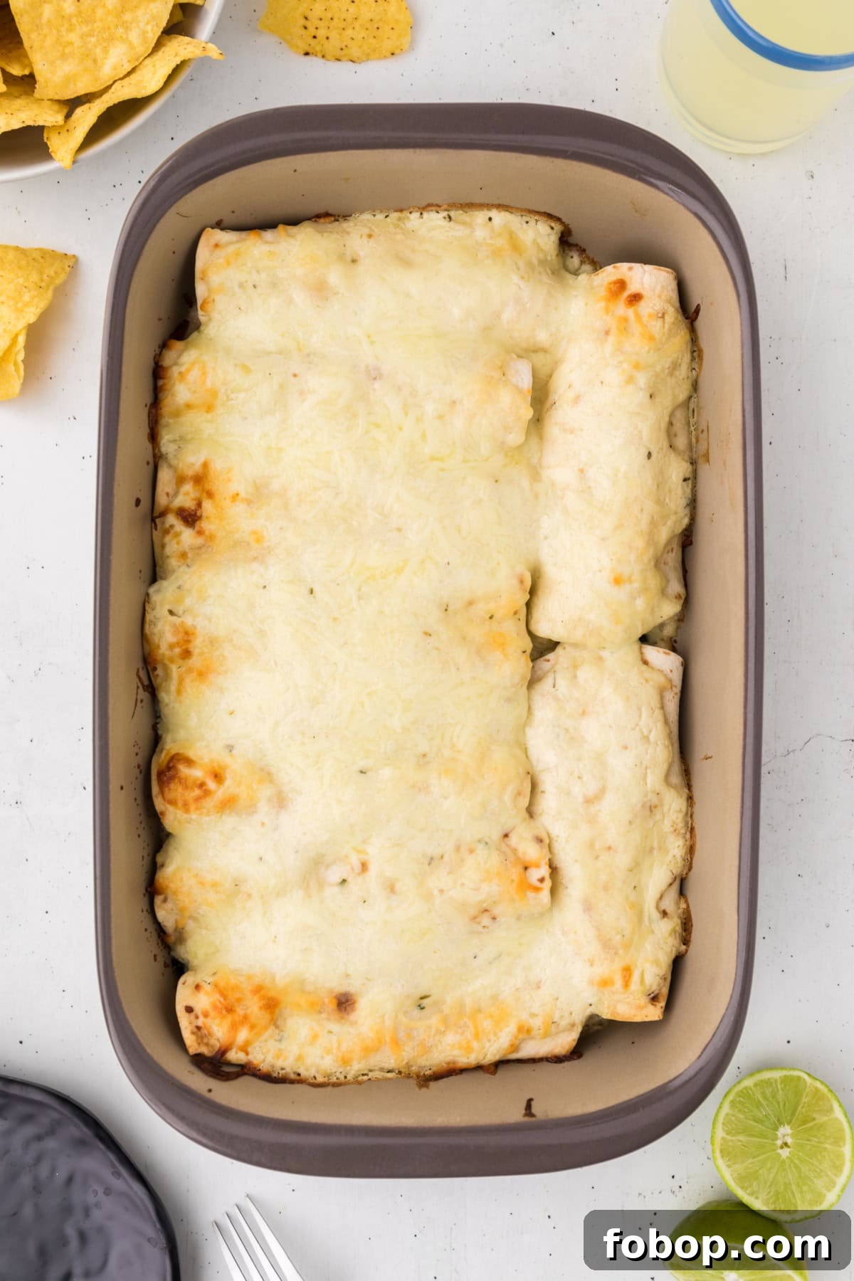Creamy Chicken Spinach and Mushroom Enchiladas recipe creamy chicken spinach and mushroom enchiladas in pan