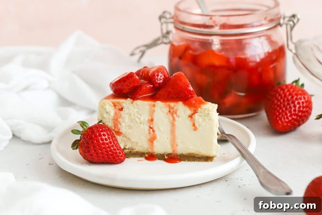 gluten-free strawberry cheesecake topped with strawberry sauce