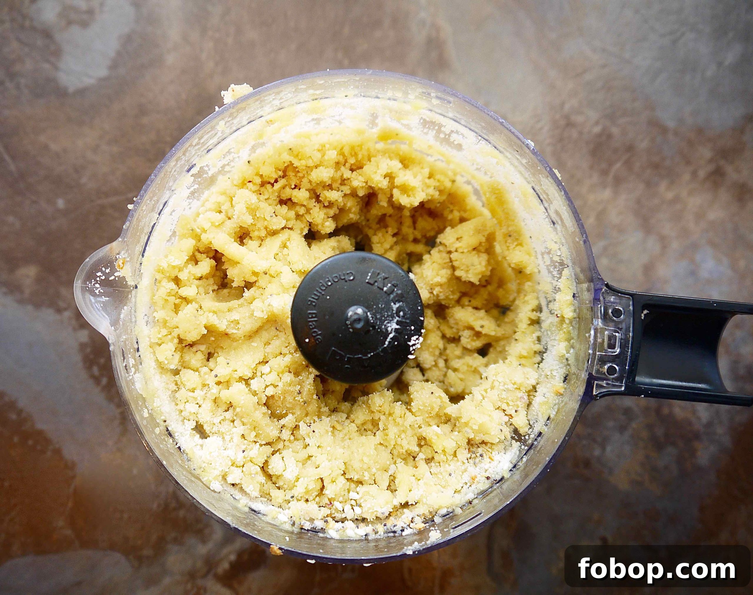 Almond flour cracker dough in a food processor.