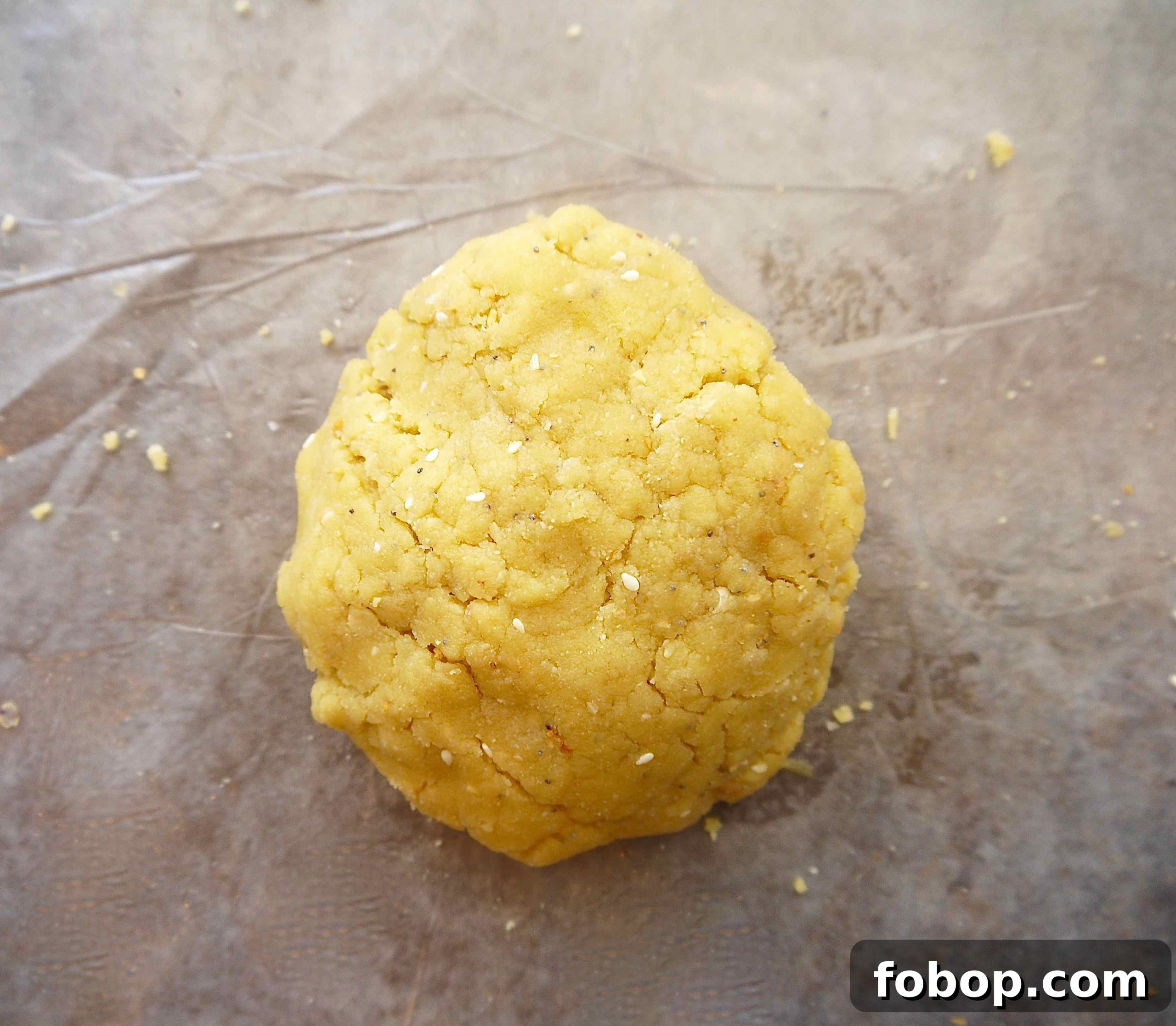 Almond flour cracker dough on table.