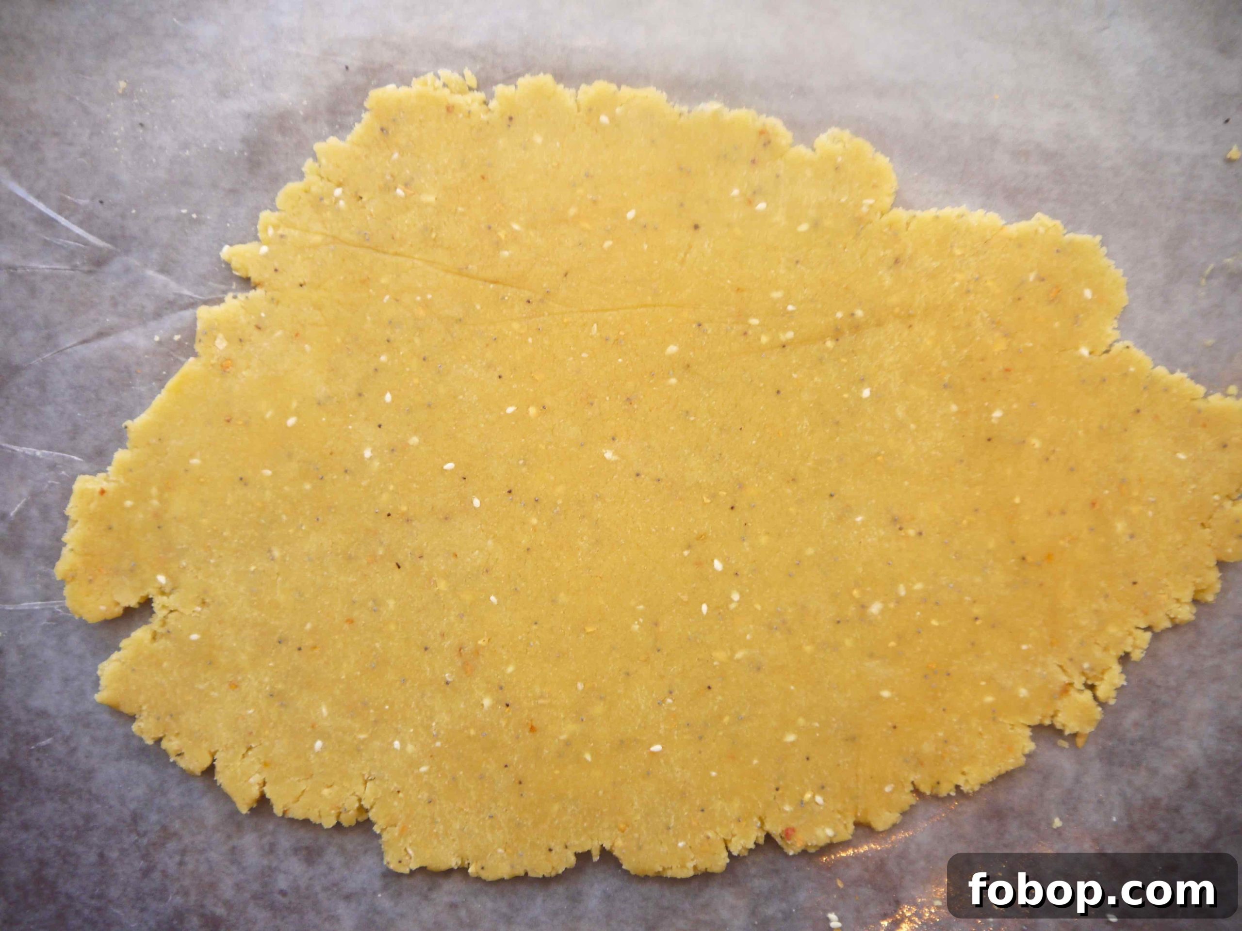 Almond flour cracker dough rolled out flat.