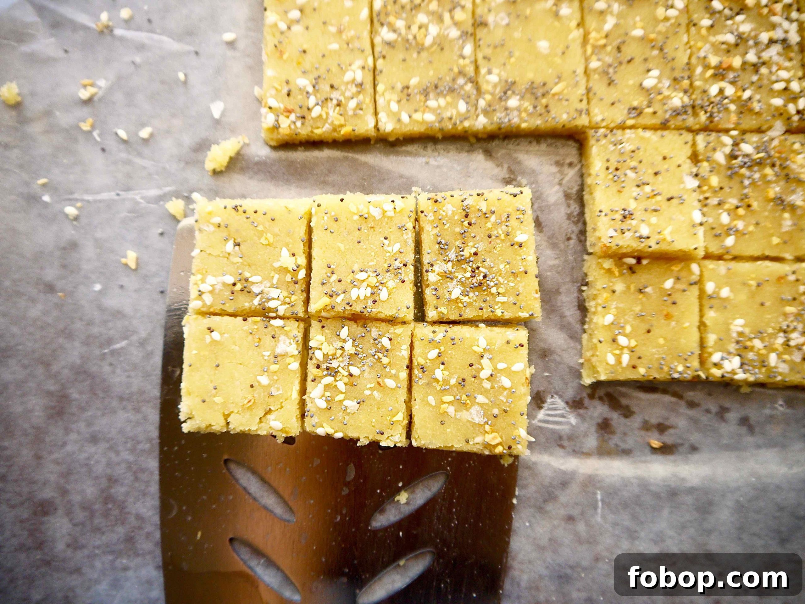 Almond flour cracker dough cut into squares before baking.