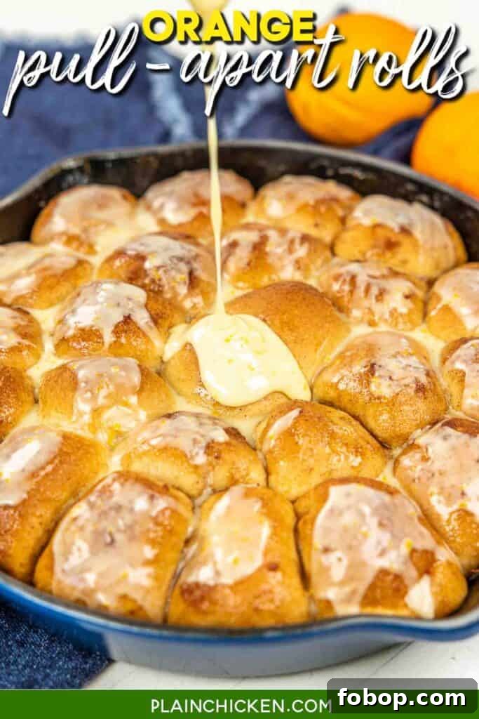 Citrus-Glazed Orange Pull-Apart Dinner Rolls 7 pouring icing over orange rolls in a skillet with text overlay