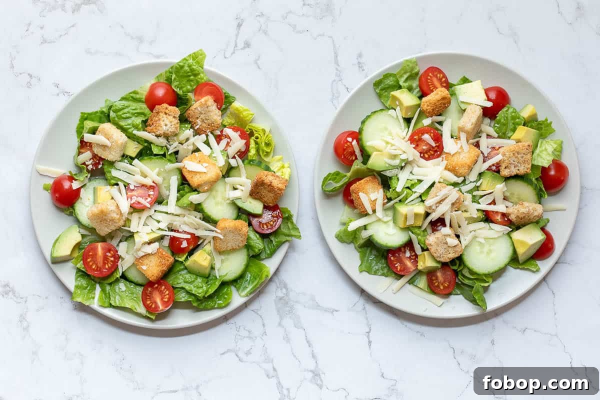 Perfect Side Salad Recipes to Complement Any Meal 7 two plates of accompaniment salad after adding parmesan cheese and croutons.