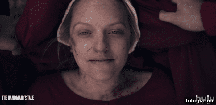 Handmaids carrying June