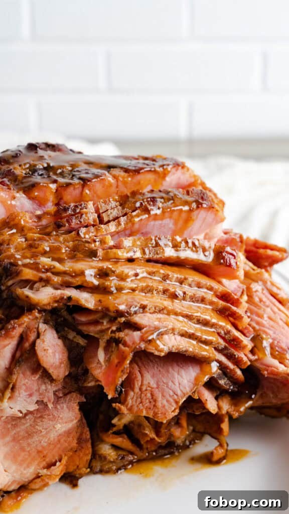 Instant Pot Honey Baked Ham with glaze on serving platter.