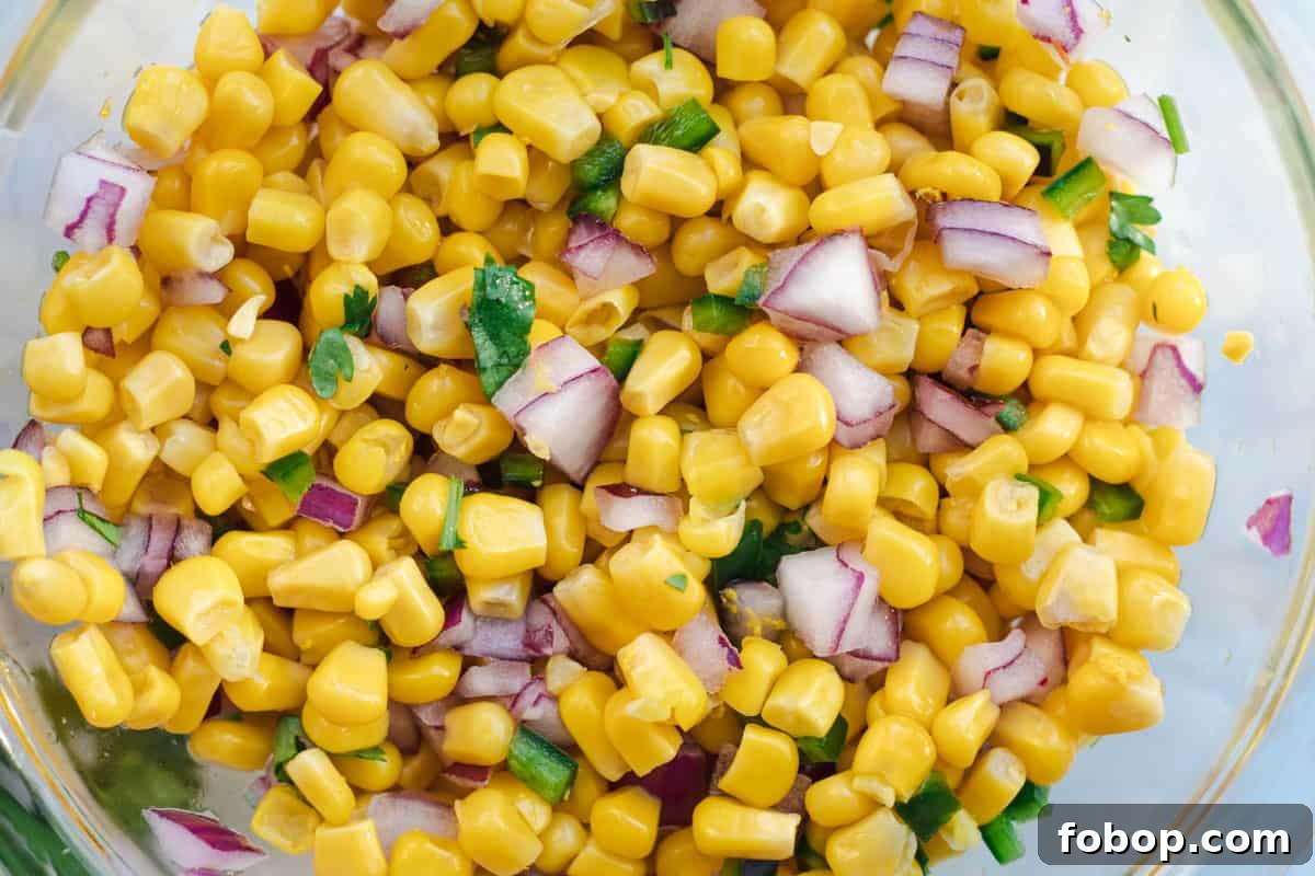 close up of corn salsa in a glass bowl