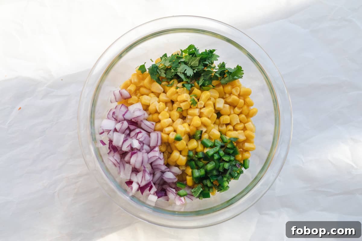 ingredients for corn salsa in a bowl