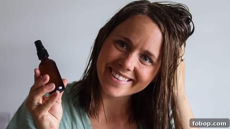 Working apple cider vinegar hair toner into recently dyed hair.