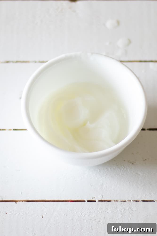 Mixing conditioner in a bowl to even out hair tones.